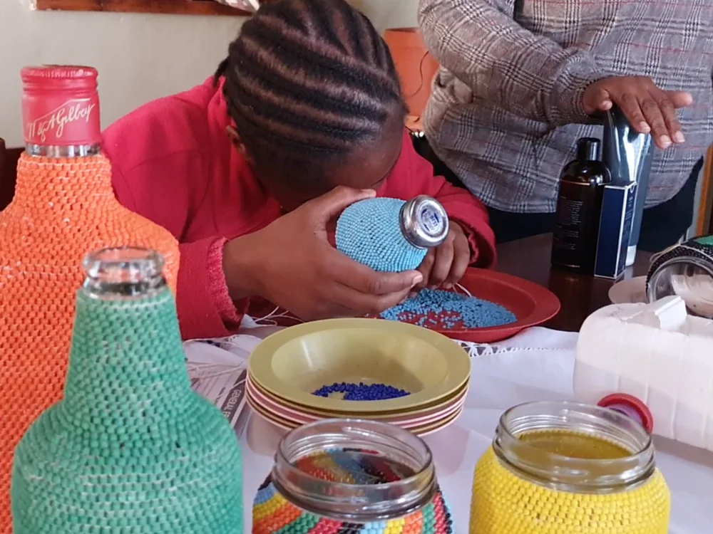 Beadwork micro-enterprise turning discarded glass bottles and jars into saleable craft products