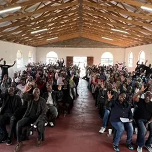 A full community hall during a broad-based stakeholder engagement meeting in South Africa